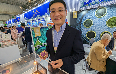 Sichuan Runzhao Sturgeon Import and Export General Manager Fu Wenyang showing off some of the company's product.