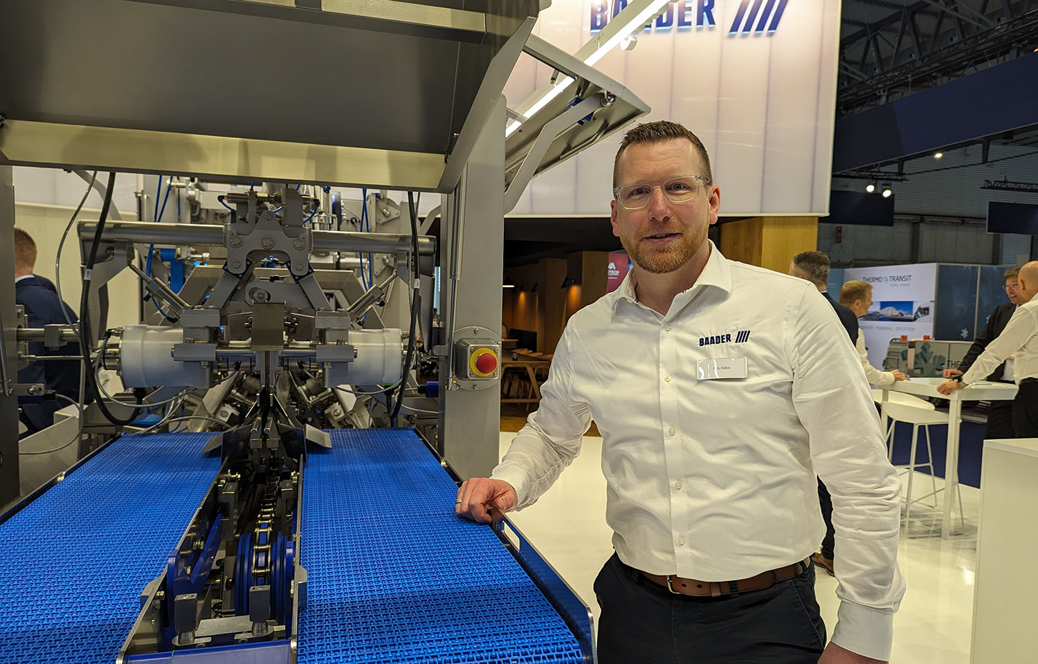 BAADER North America CEO Nils Rabe poses next to one of the company's machines