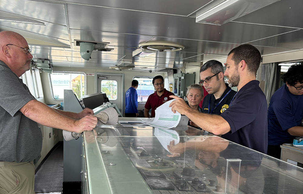 NOAA Fisheries instructors ahead of a mock boarding of a fishing vessel during a training in Bangkok, Thailand