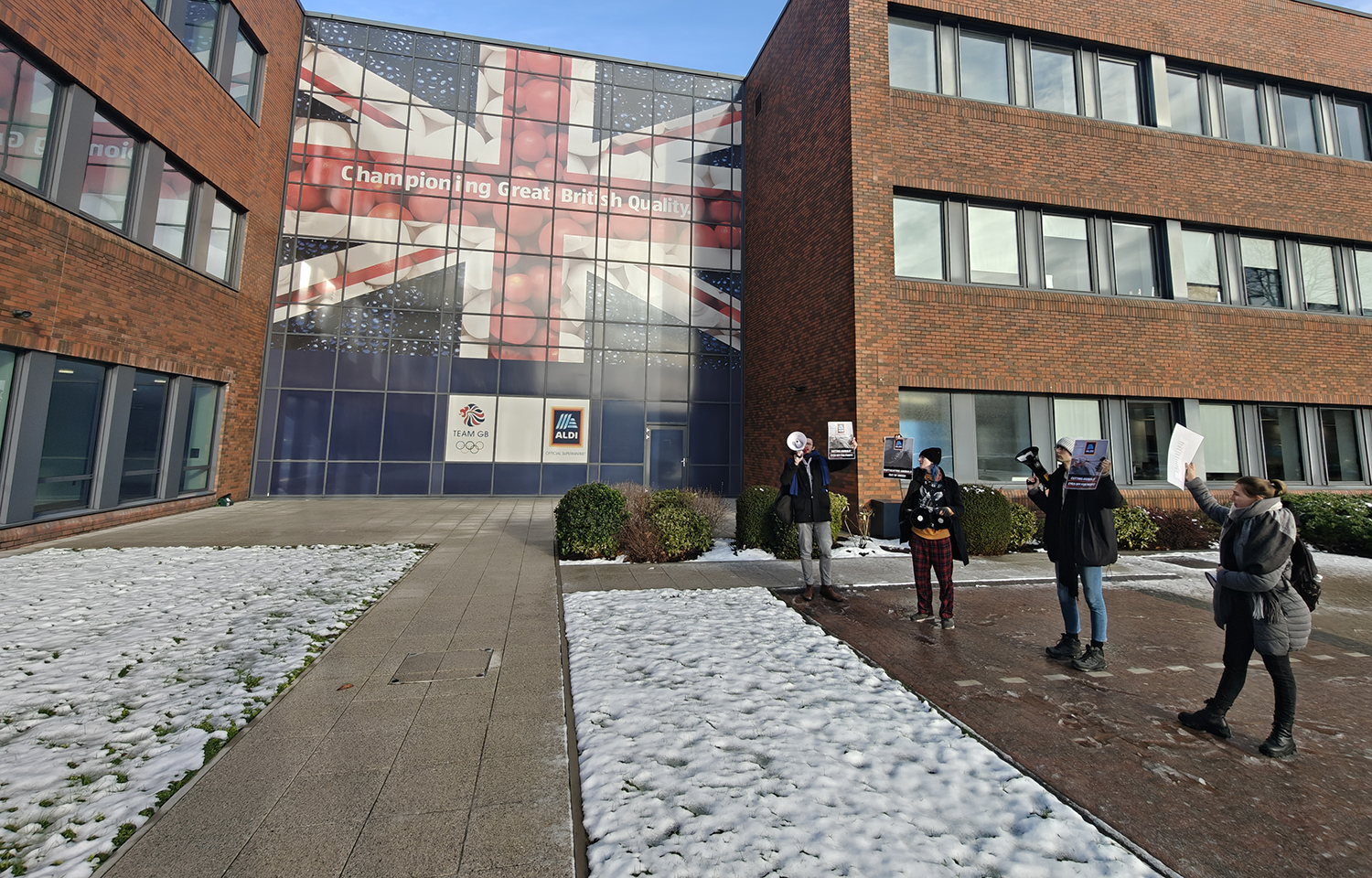 Protesters outside of Aldi UK headquarters on 9 January