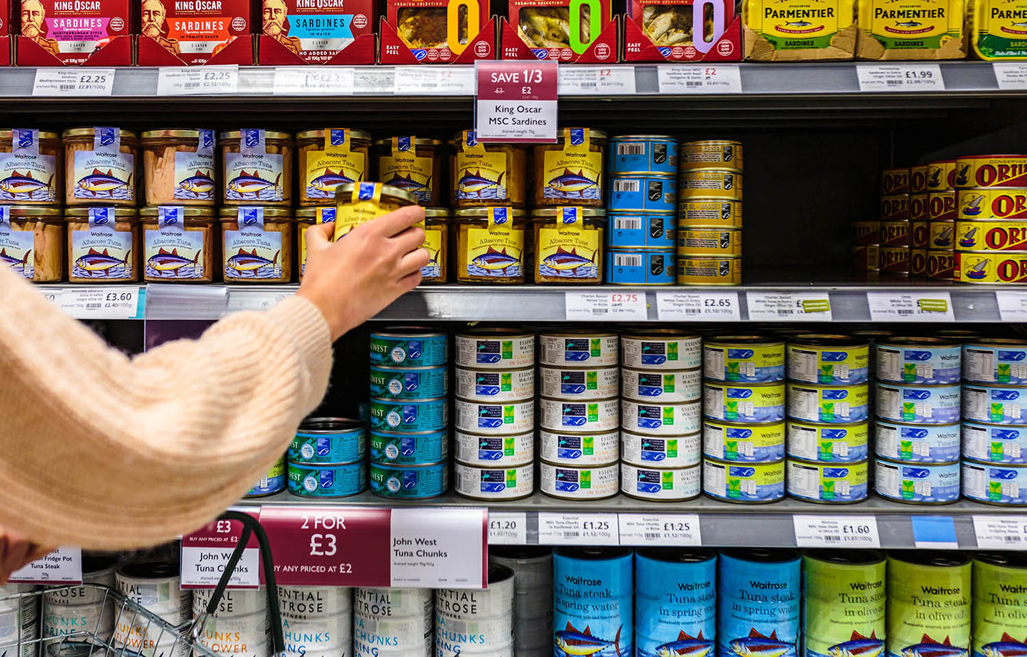 A canned seafood aisle in a U.K. grocery store