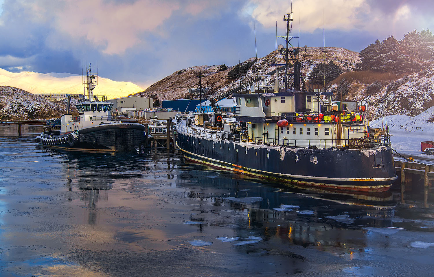 A photo of commercial fishing vessels in Alaska.