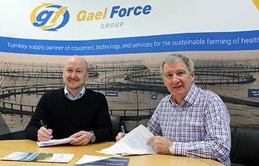 Officials with Gael Force and Cunningham Covers sign a deal.