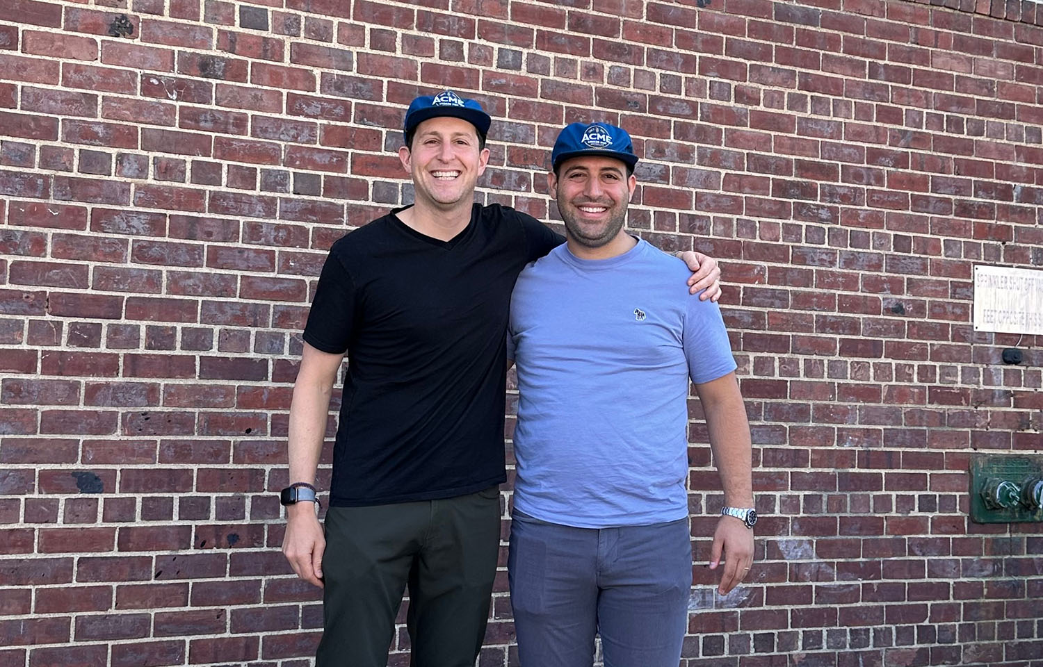 Acme Smoked Fish Managing Partner Adam Caslow (left) and Banner Smoked Fish Operations Manager Eli Attias