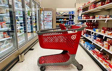 Target cart in front of refrigerated foods section