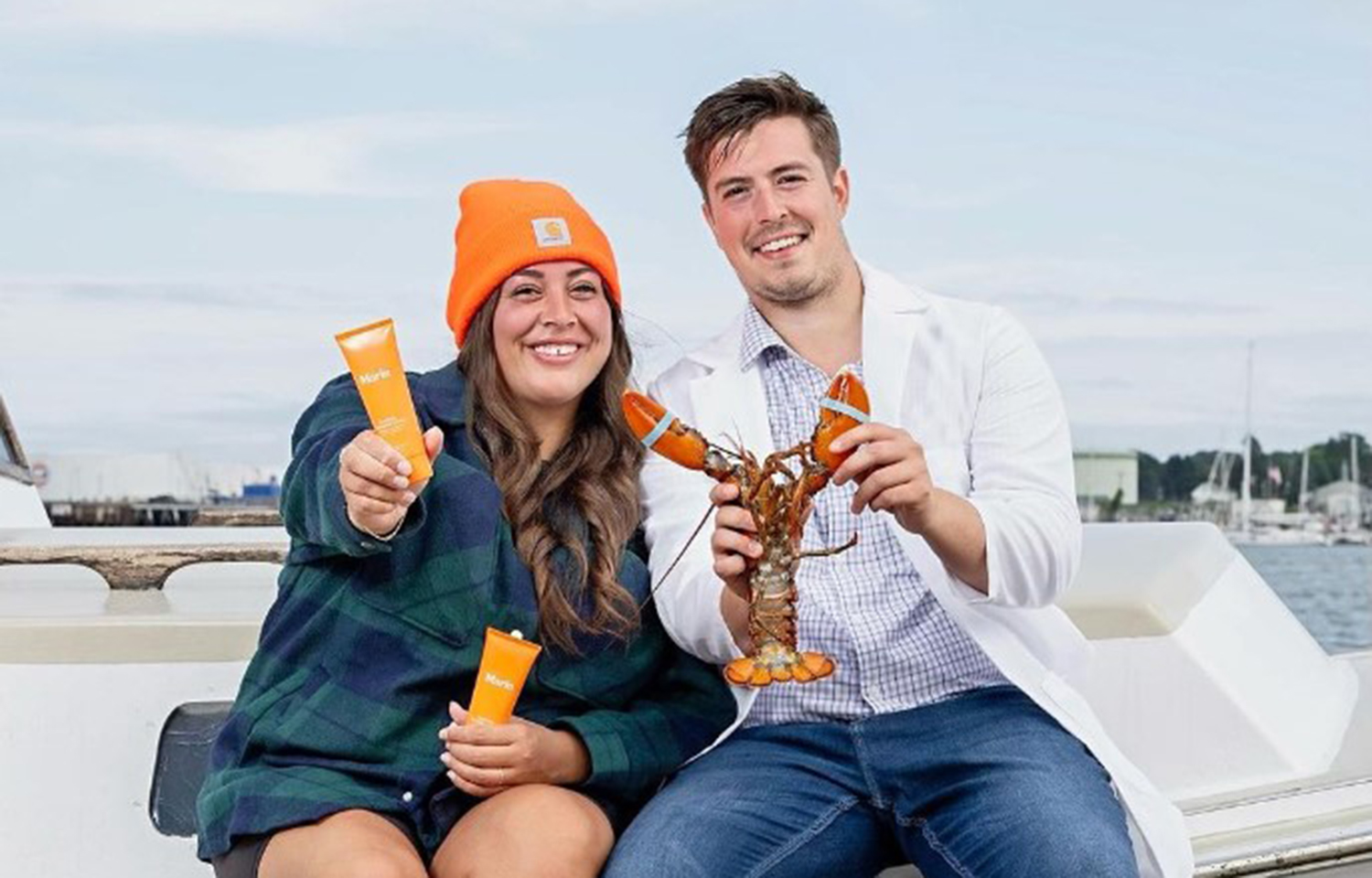 The Marin team posing with their lotion product and a lobster.