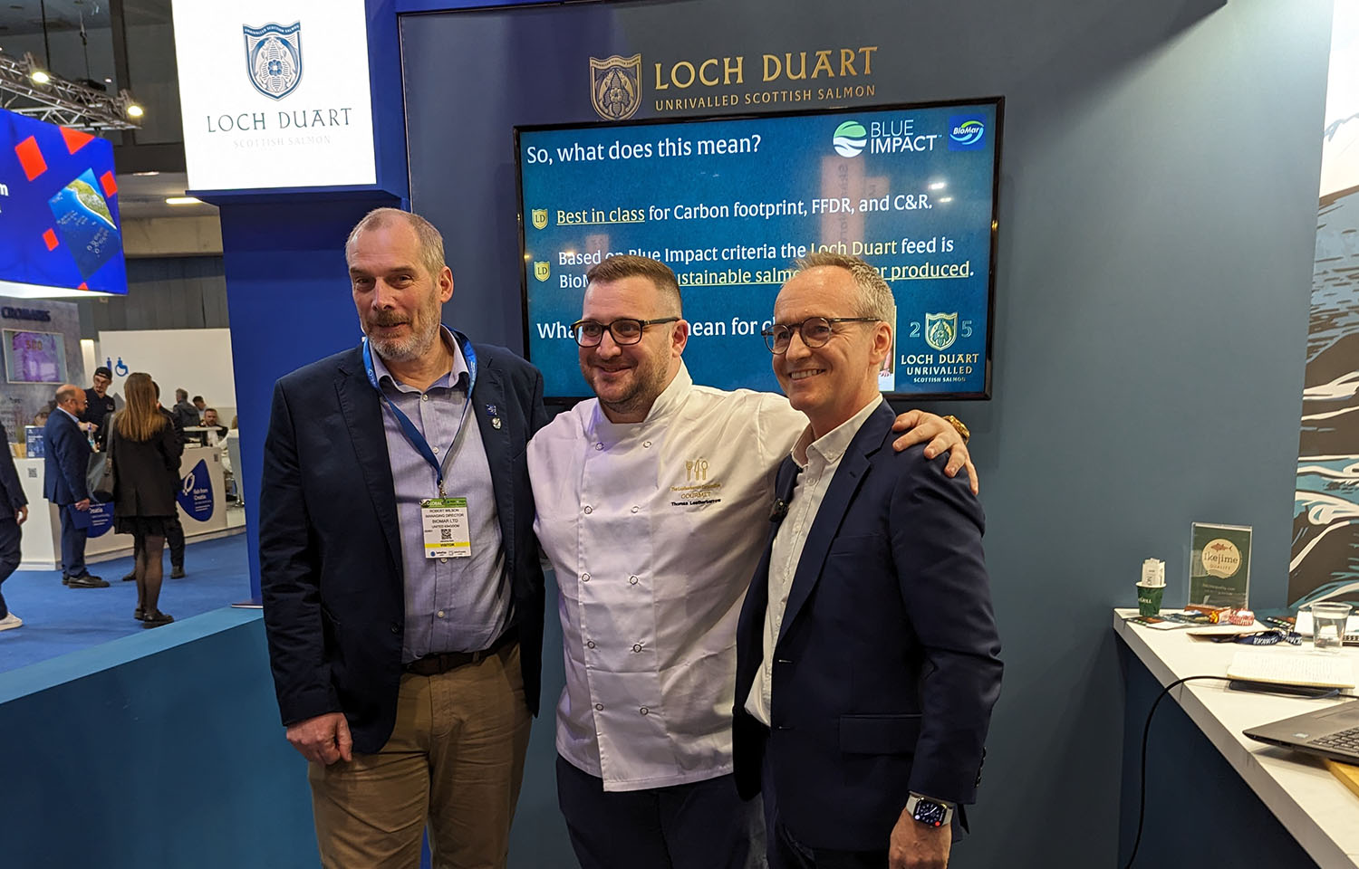 BioMar and Loch Duart employees pose in the company's booth at the 2024 Seafood Expo Global