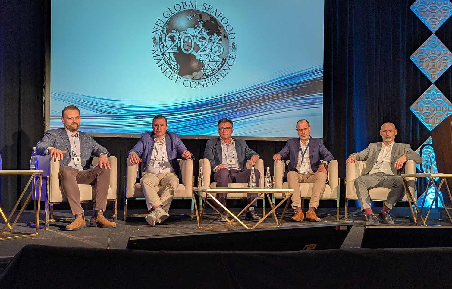 A panel of salmon experts on stage at the Global Seafood Market Conference