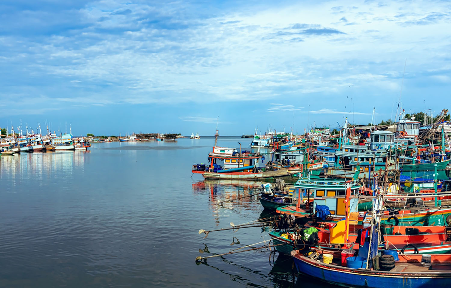 Fishing vessels docked in a fishing village in central Thailand