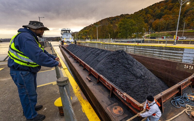 A towboat pushes a coal barge Monaca, Pa.
